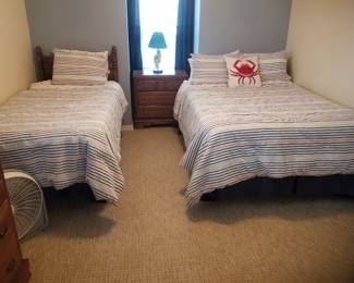 Twin bed; full size bed; nightstand; table lamp