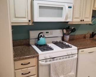 Hotpoint gas range; Whirlpool microwave oven 