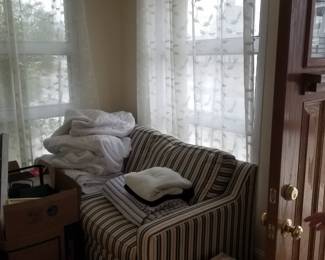 Blue & white striped couch is a sleeper sofa