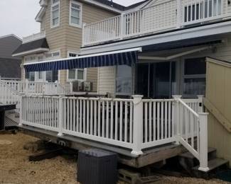 Nearly new navy & white electric awning by Sunesta