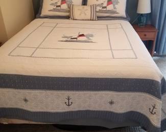 Queen bed; nightstand; table lamp 