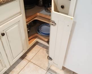 Kitchen cabinets feature a lazy Susan