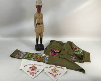 Wooden Statue and Boy Scout Uniform