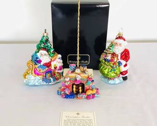 Christopher Radko "Trim a Tree-O" limited edition ornament, includes COA. H 6" x W 5" x D 3". Christopher Radko "Deluxe Delivery" ornament, H 6" x W 4" x D 2". Two boxes included. Christopher Radko "Night Before Christmas" ornament holder.