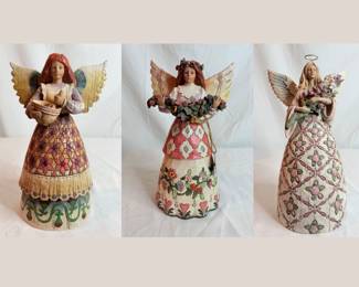 Three (3) Jim Shore figurines including "Angel of Contentment" Angel/Mixing Bowl, H 9" x 4 1/2" diameter, "Angel Of Gratefulness" Angel with Flower Garland, H 10" x 5" diameter, "With Prayer All Things Are Possible" Breast Cancer Angel Figurine, H 11 1/2" x 5" diameter.