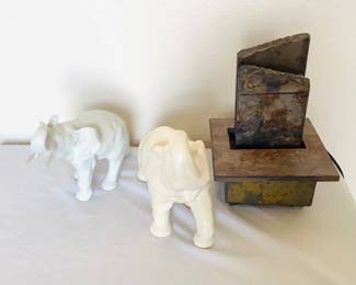 White ceramic elephant, hand painted and made in Czechoslovakia. H 6" x W 5" x D 10". Ivory ceramic elephant, unmarked. H 9" x W 5" x D 12". Slate tabletop fountain, untested. H 10" x 8" square.