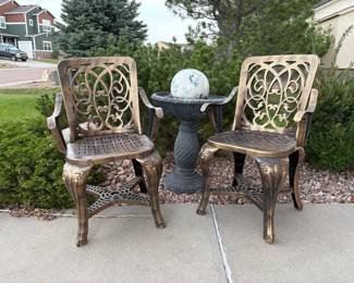 Lightweight plastic bird bath, H 25" x 20" diameter. Gazing ball. Two gold and black flecked painted plastic armchairs, H 35" x W 21" x D 21".