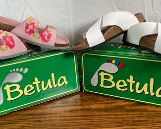 Two new pairs of Betula by Birkenstock sandals each size 38. One pair of pink floral, and one pair of white leather slip ons.