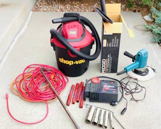 Shop Vac fie gallon portable vacuum, powers on. Model MAC12-200D. Makita polisher, powers on. Model 9218PB.Cord is frayed and held with electrical tape. ACDelco 12 volt automatic battery charger, untested.