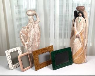 Austin Productions Native American sculpture depicting (3) women, H 23" x 8" diameter. Sculpture depicting a woman carrying a pot of water, H 22". Unmarked. An assortment of photo frames.