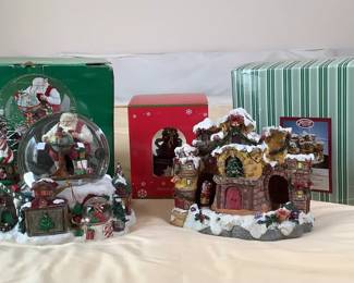 San Francisco Music Box Company "Santa in Sleigh" music box, H 7" x W 9" x D 6". JC Penney Home Collection Santa's workshop snowglobe. Appears new in box. New in box Angel musical snowglobe.