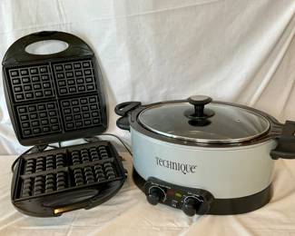 Technique multi-cooker which fries, bakes, roasts and steams. Model CETGSC6. Powers on. Very clean. GE Walmart (4) waffle maker. Model 169212. Powers on. Like new condition.