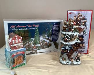 Department 56 Village Animated Accessory Set, appears new in box. Battery operated. Untested. Dickensville Collectables porcelain lighted house, appears new in box. JC Penney Home Collection lighted holiday Christmas village, H 19" x W 8" x D 7".