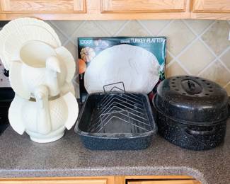 Two roasting pans, (2) large ceramic turkey candle holders H 9" x W 10" x D 10". Made by Bath and Body Works. Oggi International ceramic turkey platter 17x13.