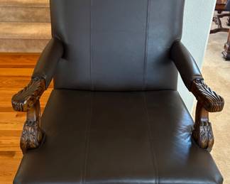 Lane faux leather armchair featuring a classical, wood carved frame. Excellent condition. H 41" x W 28" x D 24". Matches lots 93 and 95. Receipt from consignor shows Lane as the brand of furniture.