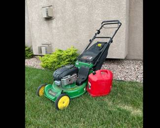 John Deere gas powered lawn power. Untested. Model JA62. Includes lawn bag and gas can.