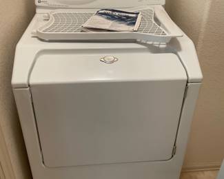Maytag Ensignia clothing dryer. Model number MDE6657BYW. Includes drying rack, user's guide and installation instructions. Powers on. H 43" x W 27" x D 27 1/2".