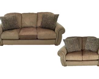 Lane Furniture sofa and loveseat. Wooden feet. Hues of green, brown and maroon. Sofa H 36" x W 83" x D 37". Loveseat measures H 36" x W 61" x D 37". Matches lot 228.