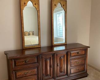 King bedroom suite which includes a gold painted wood veneer king bed frame with bed frame H 40" x W 78", a (3) drawer nightstand with dovetail drawer construction and bronzed toned hardware (top is loose) H 30" x W 34" x D 19", and a full dresser with dovetail drawer construction, bronze hardware, and (9) drawers (3 are hidden). Bed must be disassembled at pick up and mirrors need to be removed from dresser for transport. Bring tools.
