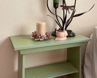 Tulip lamp featuring (3) glass shades and a metal base. Made in China. H 21" x W 8" x D 7". Powers on. Green painted wood table, some nicks and scratches. H 18" x W 23" x D 11". Additional items as shown in photos.
