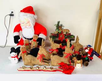 Oversized stuff Santa featuring a plastic face, H 24" x W 19" x D 19". Made by Superior Toy and Novelty. Vintage log decor featuring (2) felt deer, H 11" x W 14". Four (4) Silvestri paper mache deer figurines, H 12" x W 12" x D 3".