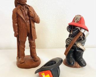 Vintage Red Mill Manufacturing 'Fireman' Sculpture, H 11", 'MFP' ceramic stack of fireman's gear, H 8 ", and 1990 Princeton Gallery porcelain fire hat 'Where's the Fire?' H 3". See photos for details.