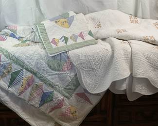 Patchwork heart design quilt, appears to be machine finished. 96x80. Includes (2) matching shams. Ivory and gold king size quilted coverlet.