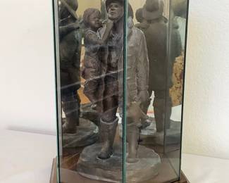 Michael Garman 'Firefighter Hero with Young Girl' statue, vintage 1986, H 14", bronze tone. Statue stands in glass case with wood base.
