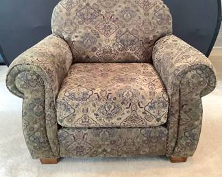 Lane Furniture oversized chair, H 35" x W 43" x D 37". Wooden feet. Hues of green, brown and maroon. Matches lot 229.