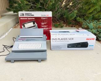 New in box Sanyo DVD/VHS combo player. Model FWDV225F. Smith Corona DeVille 580 electronic typewriter. Powers on.