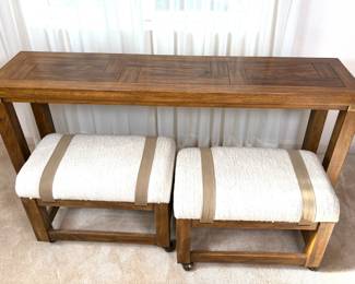 Drexel "Woodbriar" wooden sofa table, H 28" x W 60" x D 14". Minor nicks and scuffs. Two matching rolling upholstered stools, H 17" x W 23 1/2" x D 13 1/2". Minor dirt on fabric. Matches lots 214 and 215.