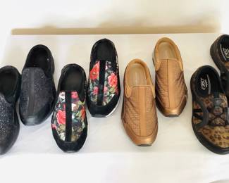Four new pairs of Easy Spirit footwear. Includes (3) pairs of "Travel Time" in ivory, black and bronze size 8 and (1) pair of leopard print slip on shoes size 7 1/2.