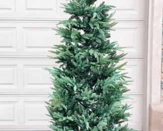 7 1/2' slender Christmas tree, pre lit with colored lights. Untested. Assembly instructions included.