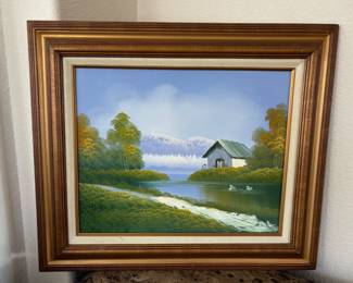 Appears to be an original oil painting depicting a riverside and mountains. Signed "Rothman". Gold toned wood frame and linen mat. H 23" x W 28".