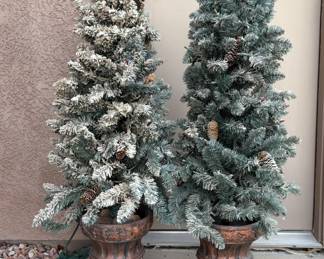 Pair of flocked, potted faux Christmas trees. Prelit. Untested. H 52" x 16" diameter.