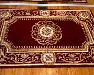 Momeni Oriental style rug, featuring hues of tan and maroon. H 60" x W 96".