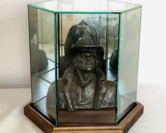 1992 Michael Garman 'Firefighter Bust', stamped, #052-Bronzetone, H 7". Bust comes in a glass case with wood base.