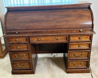 Roll top wood desk features (9) drawers (2) are for filing) and cubbies, H 44 1/2" x W 54" x D 24", some signs of wear, see photos for details.