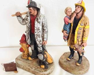Michael Garman Statues: 'Firefighter', #2015-Tan/Yellow, H 13 1/2", stamped; 'Back to Station', #2209-HPP, H 14" , stamped, fireman's axe is chipped off at the end.