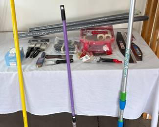 An assortment of painting supplies including rollers, brushes, paint trays, edging tools and more. See photos for sampling.