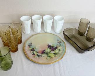 Four (4) milk glass drinking glasses, H 6". Eight (8) assorted colored water glasses. Vintage glasbake smokey gray loaf pan, 5 x 9 and more.