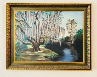 What appears to be an original painting depicting Spanish moss covered trees overlooking a lake. Signed by "Walston". Wood look frame. H 22 1/2" x W 28 1/2".
