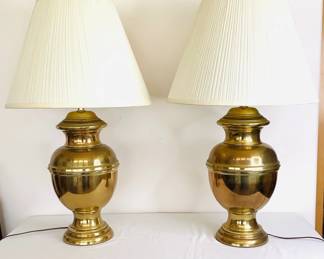 Pair of brass table lamps with ivory pleated shades. No manufacturer found. H 34" x 18" diameter.
