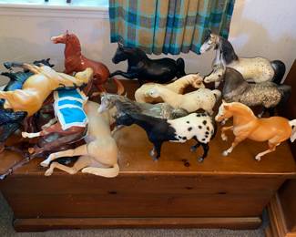 More horses atop hinged lid chest