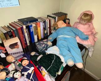 A few dolls laying down on the job