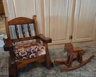 Small children's wood rocking chair and vintage rocking horse toy.