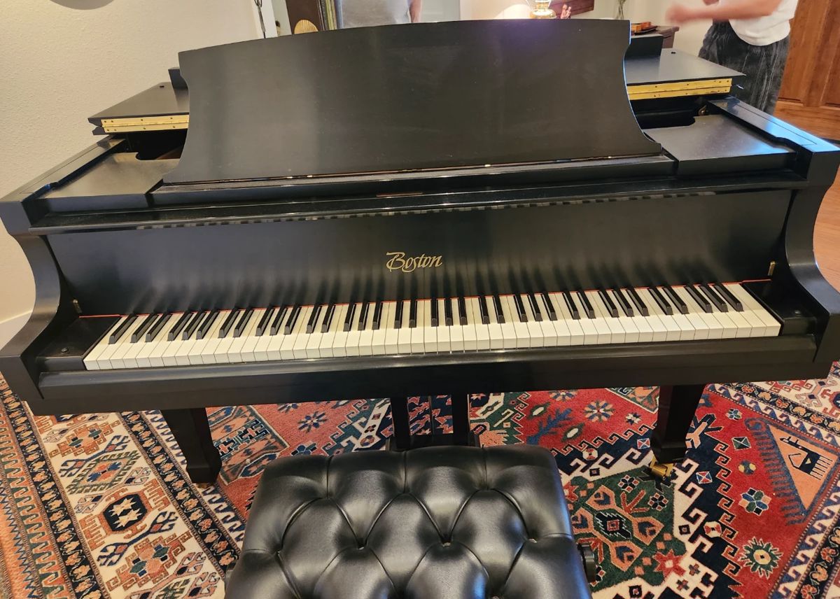 Boston Ebony grand piano with adjustable leather tufted bench...excellent condition!