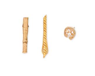 1117
A Group of Gold Accessories Including David Webb
Including an 18K Gold twisted David Webb tie clip, a 14k gold bamboo style tie clip and a 14k gold and cultured pearl horseshoe tie pin
3 pieces
Measures: 1/2 -2 in.
14.9 grams gross
Estimate: $800 - $1,200