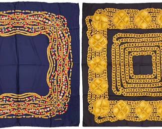 1156
CHANEL: Two Vintage Silk Scarves
Comprising a navy silk scarf with gold and multicolored jeweled chain print, and a black silk twill scarf with gold curb chain and medallion print, each with hand-rolled hem, care label, 100% silk, Made in Italy
2 pieces
Larger: 35 1/2 in. x 34 1/2 in.; Smaller: 35 in. x 34 in.
Estimate: $200 - $400