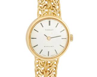 1137
Tissot: An 18k Gold Wristwatch
Dial: 17.70 mm, round with baton hour markers
Case: 21.00 mm
Closure: jewelry clasp finished with a woven gold bracelet
Signed: dial and clasp
Inner circumference: 7 in.
32.7 grams gross
Estimate: $1,000 - $2,000